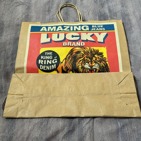 Vintage Lucky Brand Jeans brown paper shopping bag.  Circus themed. Used. - Picture 2 of 3